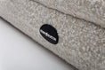 Bild in Galerie-Betrachter laden, Close-up of textured beige Bouclé fabric and Benjy & Burton logo on Hundebett Barklay S dog bed with washable cover and memory foam mattress