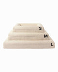 Bild in Galerie-Betrachter laden, Stacked beige Hundebett Barklay S dog beds with washable boucle cover in sizes small, medium, and large.